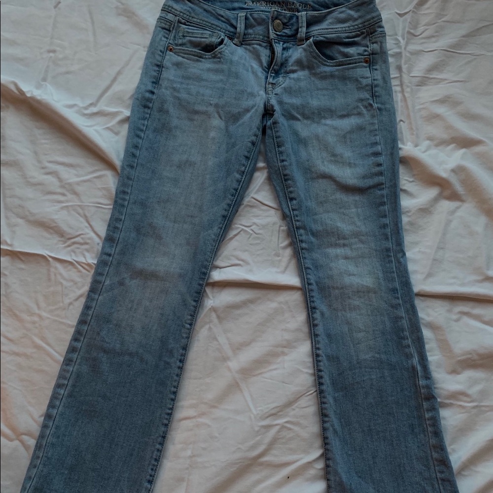Light-wash low rise flare American Eagle jeans.